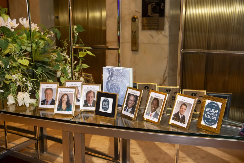 Framed photos of past GLAR honorees on display