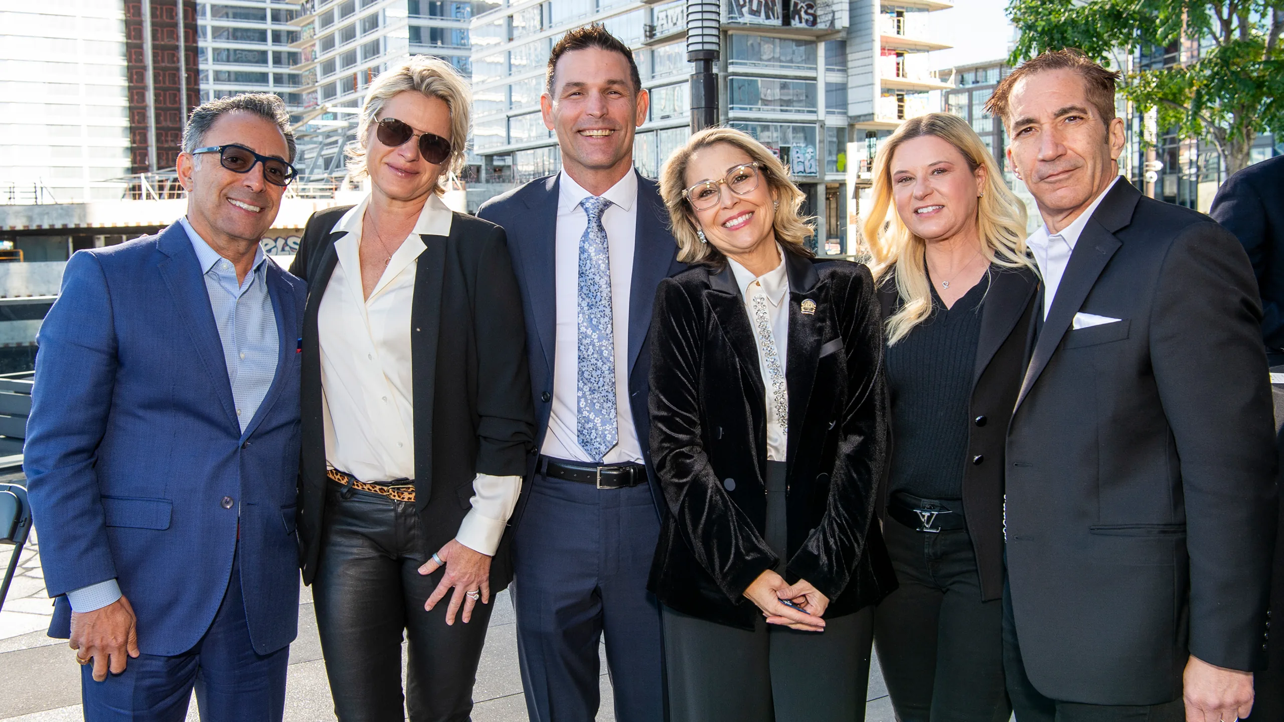 GLAR members outside with the Los Angeles skyline behind them