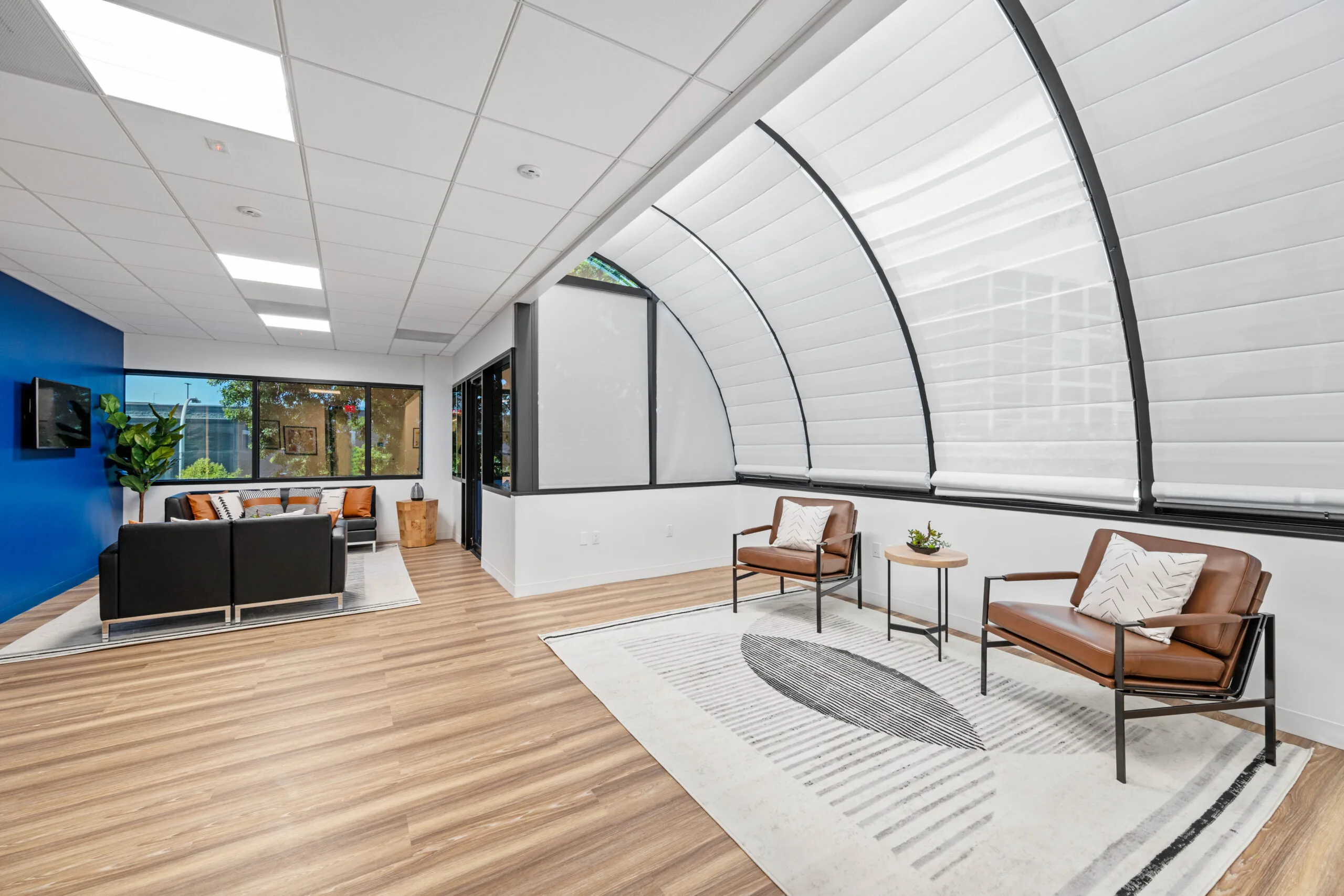 GLAR lounge with leather seating and arched windows